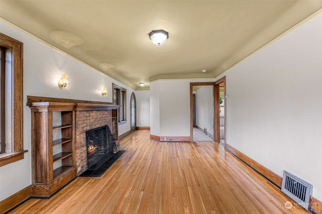 a view of main area with furniture and fireplace