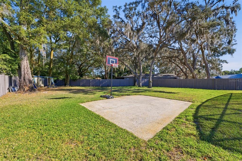 12515 Shadow Ridge Boulevard Hudson, FL 34669 - Photo 35 of 43 a view of a house with a big yard