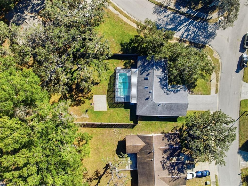 12515 Shadow Ridge Boulevard Hudson, FL 34669 - Photo 43 of 43 a front view of a house with a garden