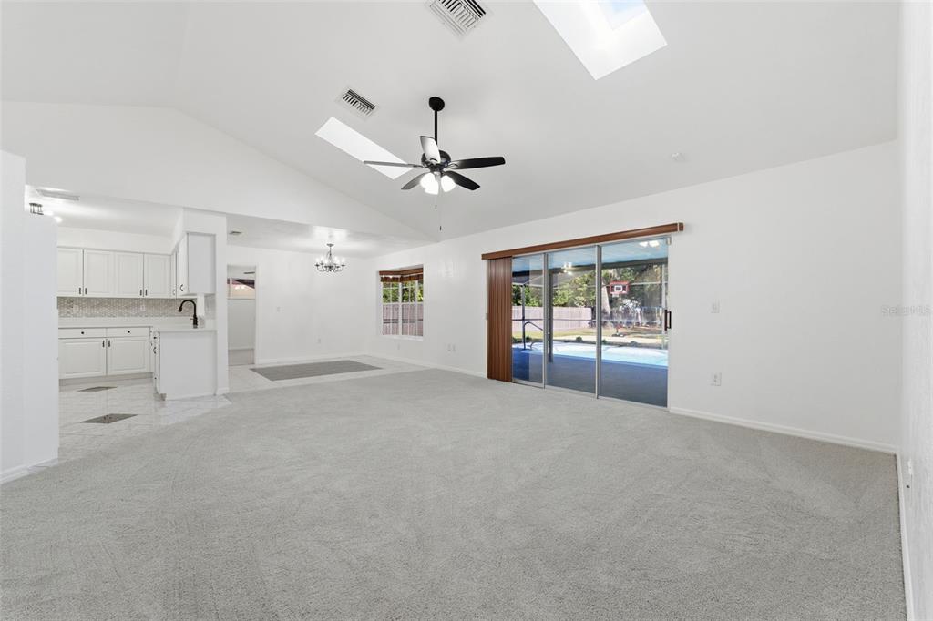 12515 Shadow Ridge Boulevard Hudson, FL 34669 - Photo 6 of 43 a view of an empty room with a window