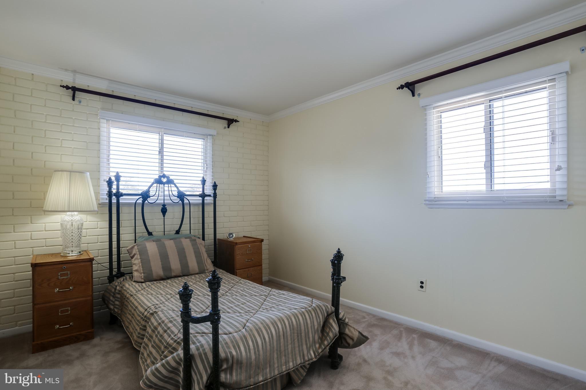 1513 Adamsview Road Baltimore, MD 21228 - Photo 22 of 30 a bedroom with a bed and wooden floor