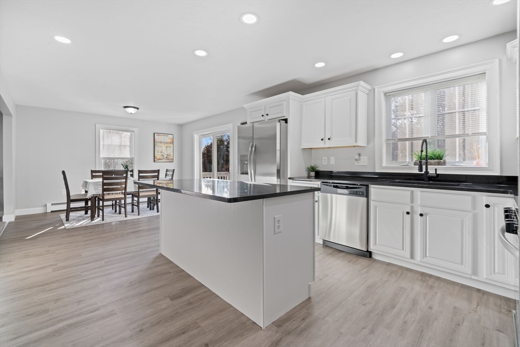 30 Foster Court Gardner, MA 01440 - Photo 12 of 37 a kitchen with stainless steel appliances granite countertop a stove top oven a sink a counter space and cabinets