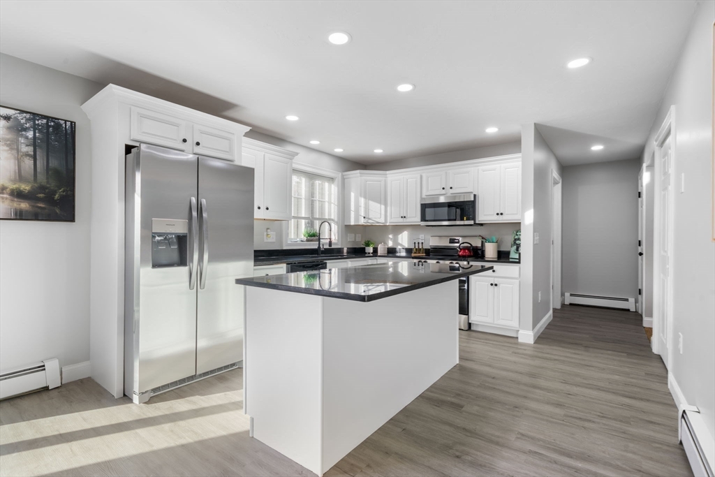 30 Foster Court Gardner, MA 01440 - Photo 14 of 37 a kitchen with stainless steel appliances granite countertop a refrigerator and a stove top oven