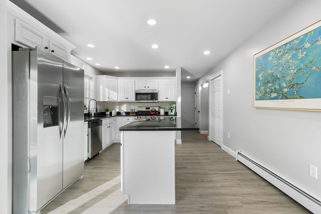 30 Foster Court Gardner, MA 01440 - Photo 15 of 37 a kitchen with stainless steel appliances granite countertop a refrigerator sink and stove