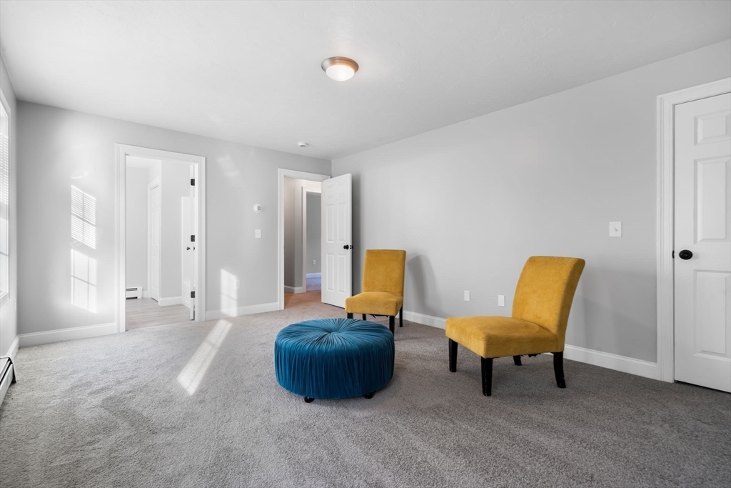 30 Foster Court Gardner, MA 01440 - Photo 16 of 37 a living room with furniture and a chair