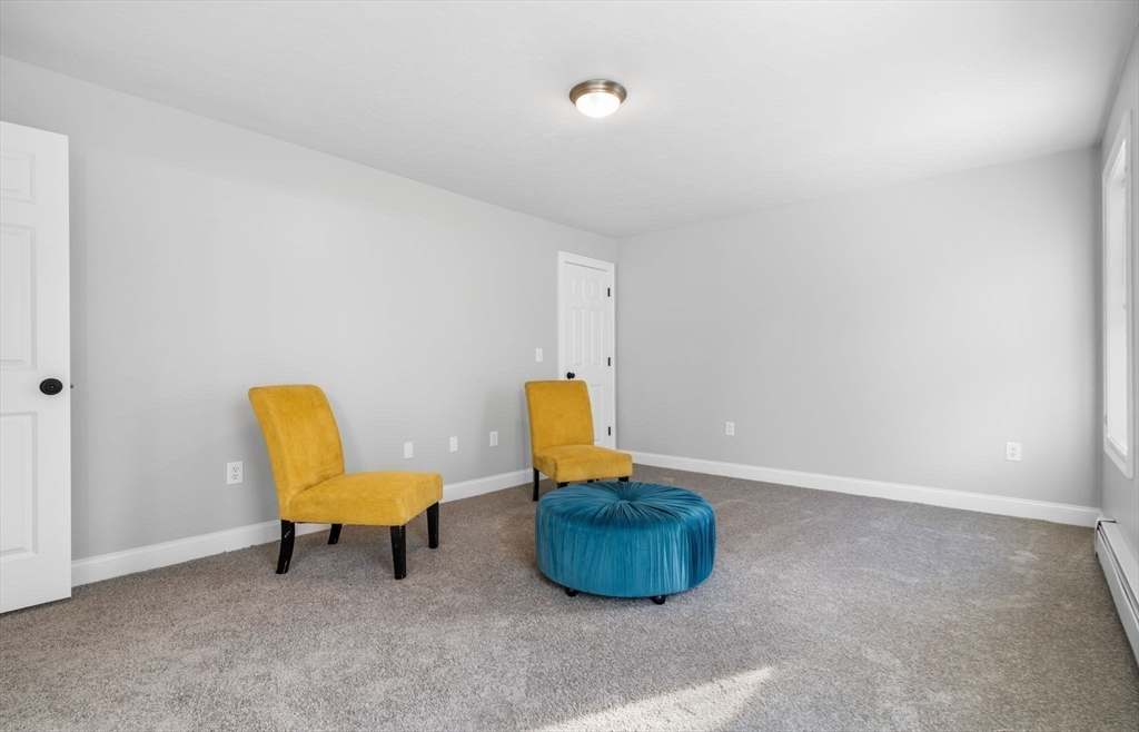 30 Foster Court Gardner, MA 01440 - Photo 17 of 37 a living room with furniture and a chair
