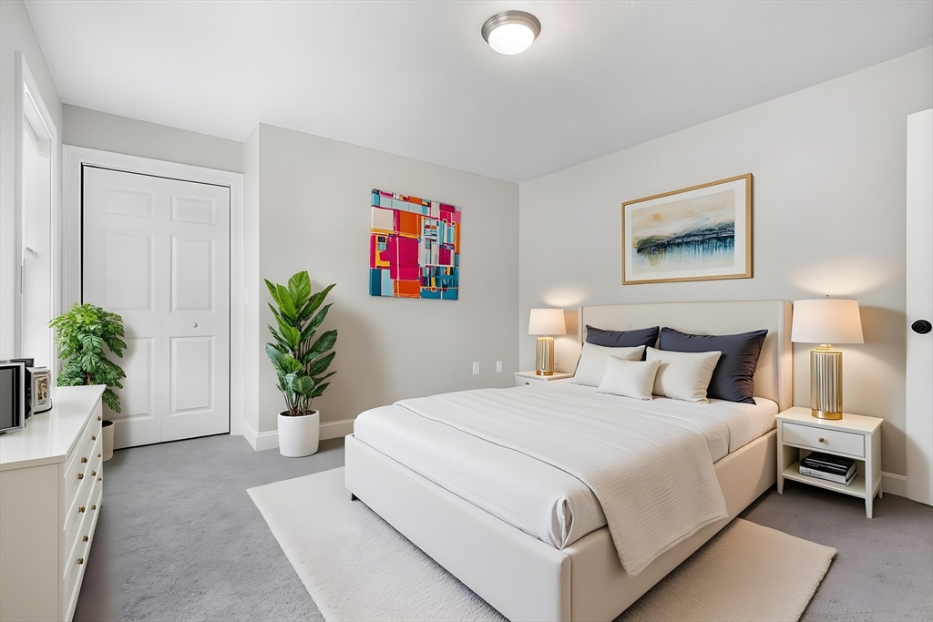 30 Foster Court Gardner, MA 01440 - Photo 20 of 37 a bedroom with a bed and a potted plant