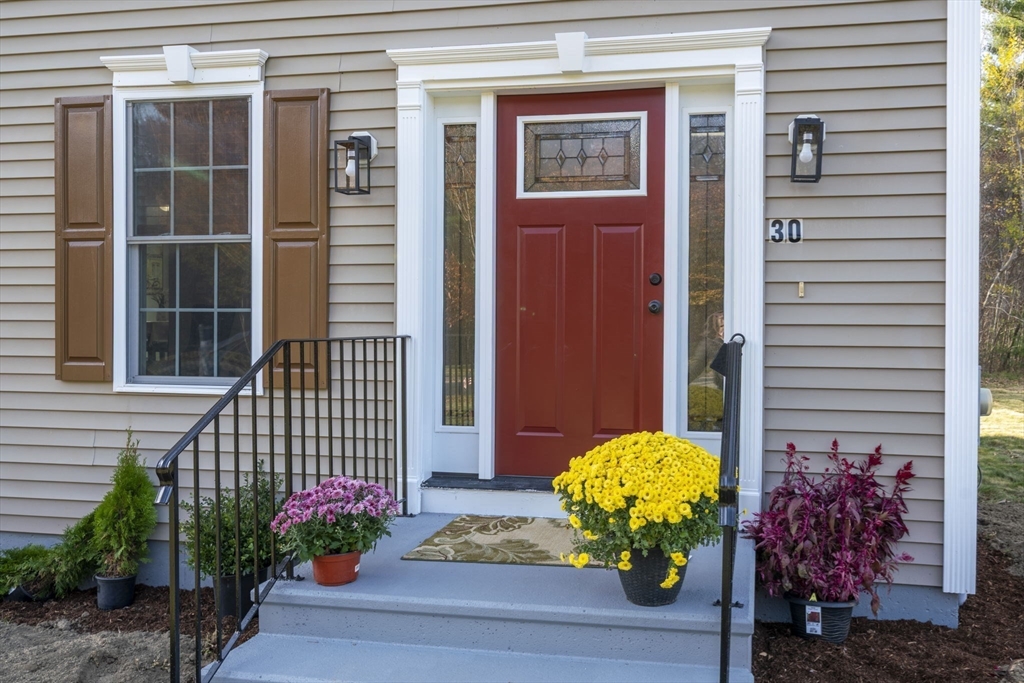 30 Foster Court Gardner, MA 01440 - Photo 2 of 37 a vase of flowers sitting on a floor
