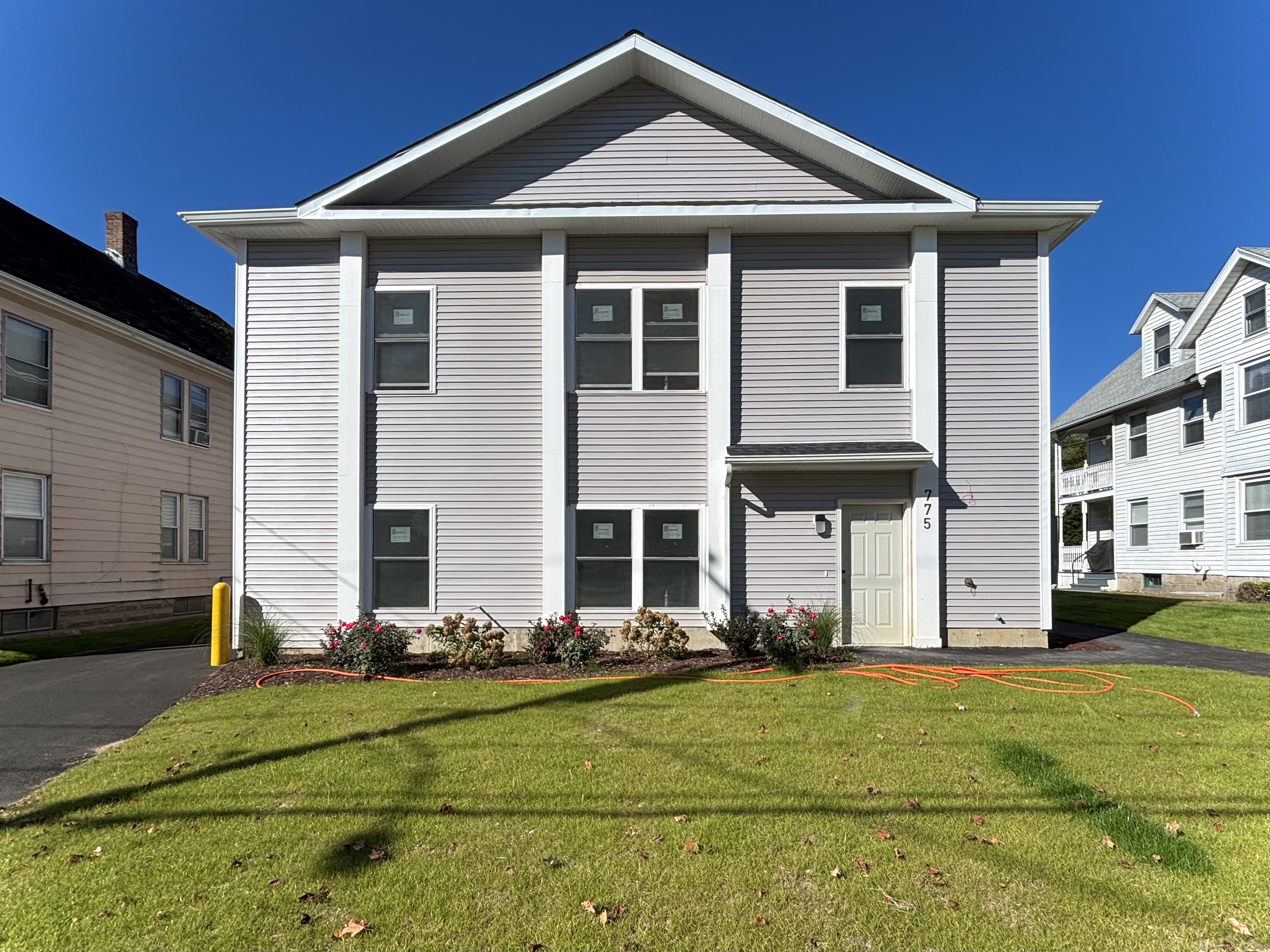 a front view of a house with a yard