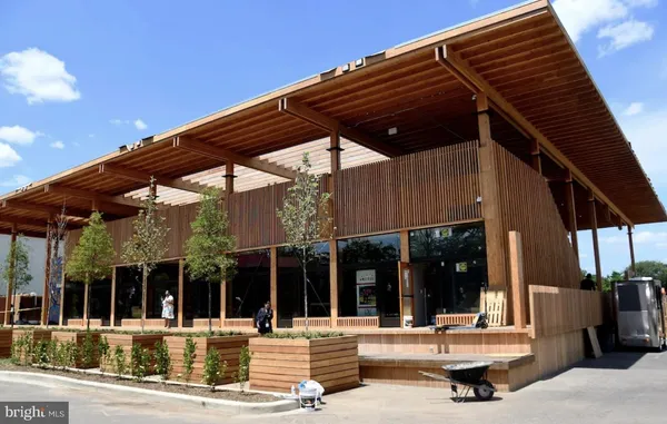 a view of a patio with a table and chairs under an umbrella