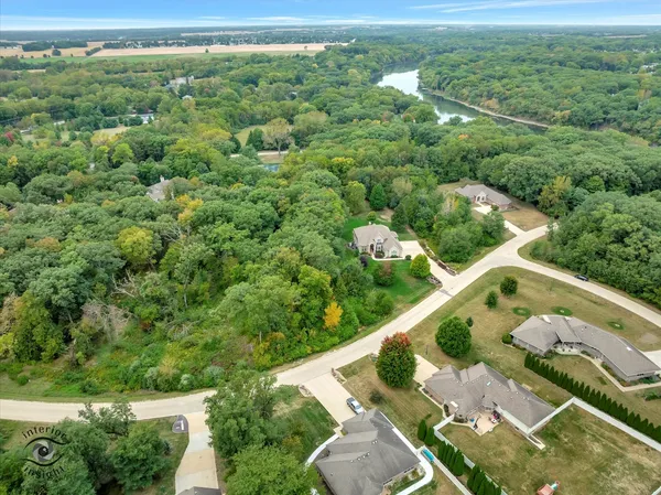 an aerial view of a house with yard