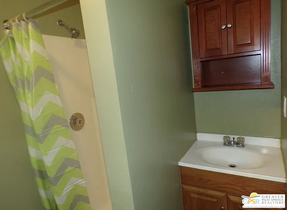 32407 Sonoma Circle, Unit A Thousand Palms, CA 92276 - Photo 5 of 5 a bathroom with a sink and a mirror