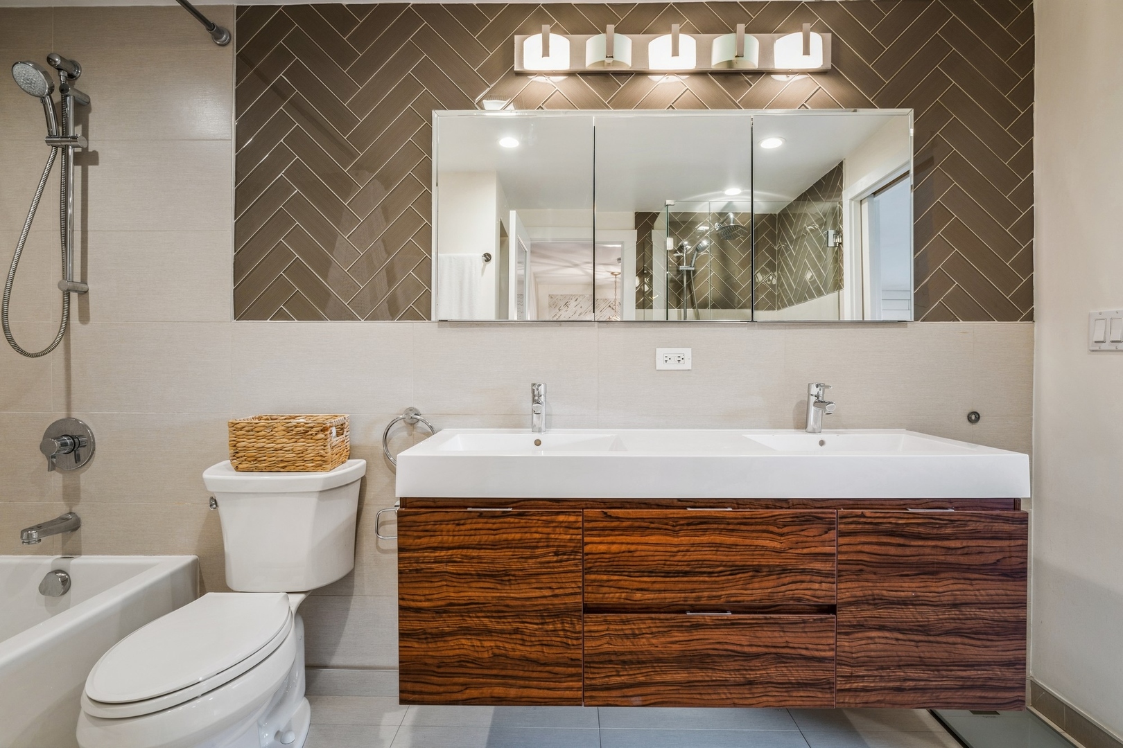 1063 Busse Highway Park Ridge, IL 60068 - Photo 12 of 16 a bathroom with a sink a toilet and a mirror