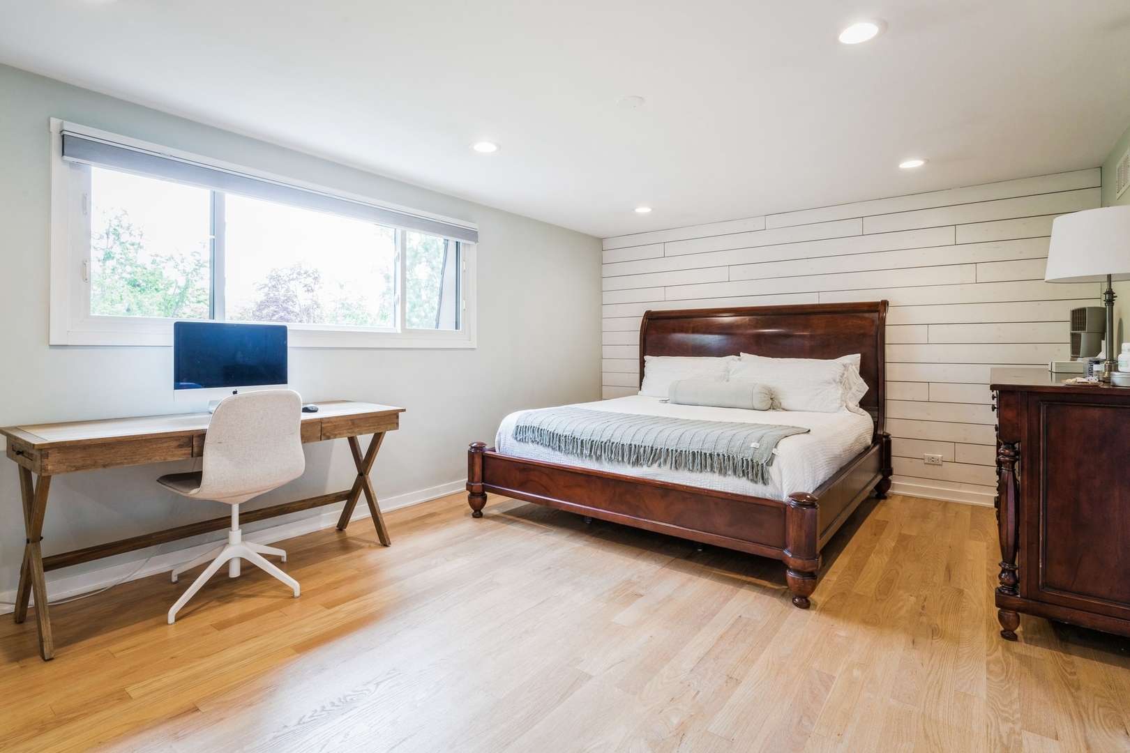1063 Busse Highway Park Ridge, IL 60068 - Photo 9 of 16 a bedroom with a bed a chair and a dresser next to a window