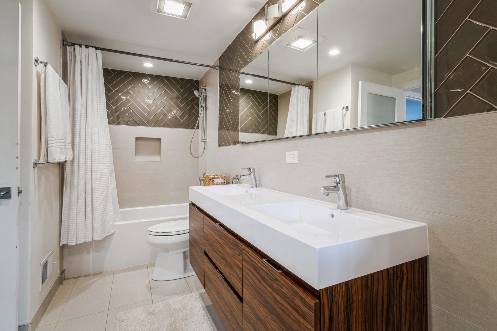 1063 Busse Highway Park Ridge, IL 60068 - Photo 10 of 16 a bathroom with a sink a toilet and mirror