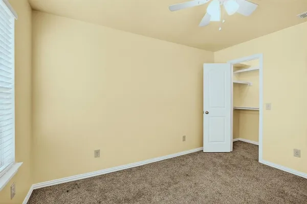 an empty room with a bathroom