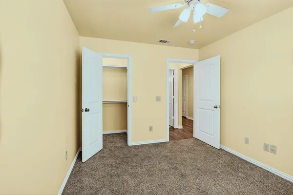 an empty room with a bathroom
