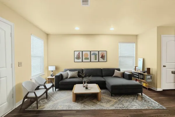 a living room with furniture and a couch