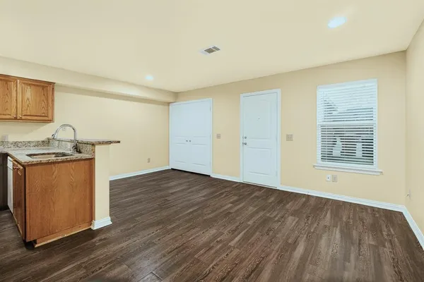 a view of front door with wooden floor