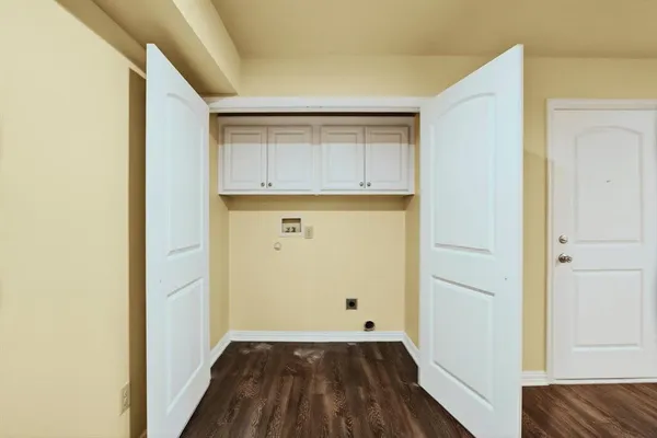 a view of a kitchen with wooden floor