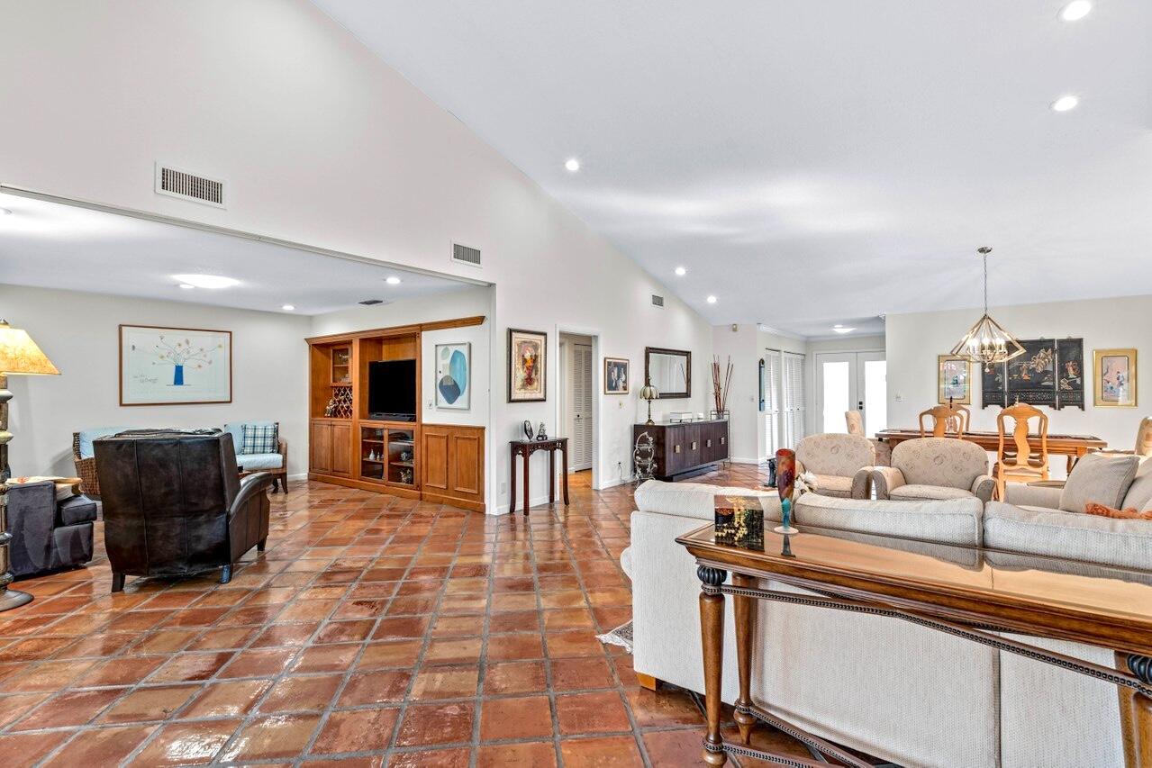 19 Glens Drive West Boynton Beach, FL 33436 - Photo 11 of 69 a living room with furniture a dining table and chairs with wooden floor
