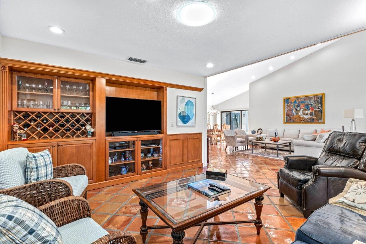 19 Glens Drive West Boynton Beach, FL 33436 - Photo 14 of 69 a living room with furniture and a flat screen tv