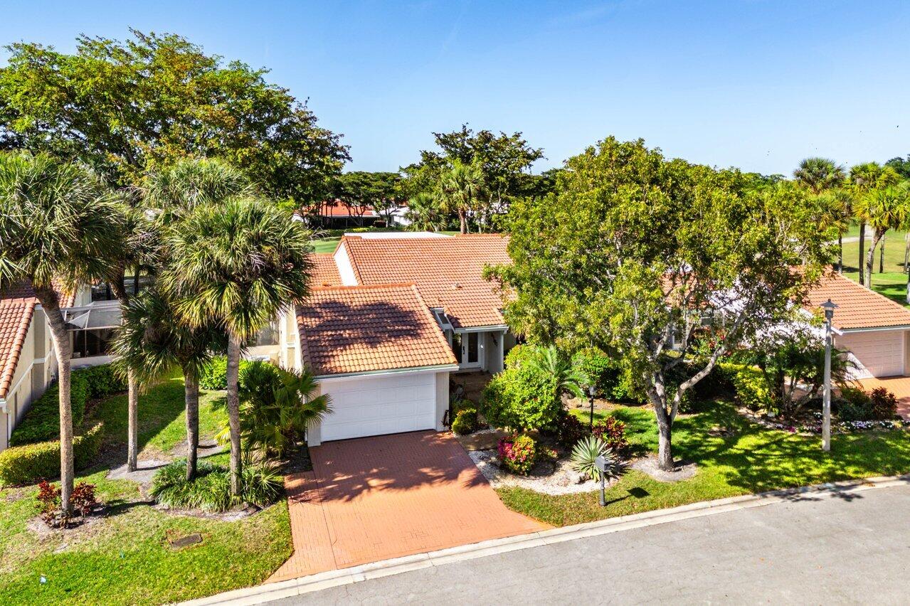 19 Glens Drive West Boynton Beach, FL 33436 - Photo 2 of 69 front view of a house with a yard
