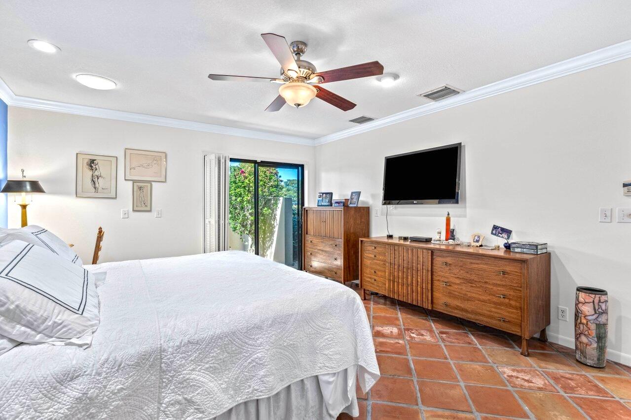 19 Glens Drive West Boynton Beach, FL 33436 - Photo 25 of 69 a bedroom with a bed and a flat screen tv