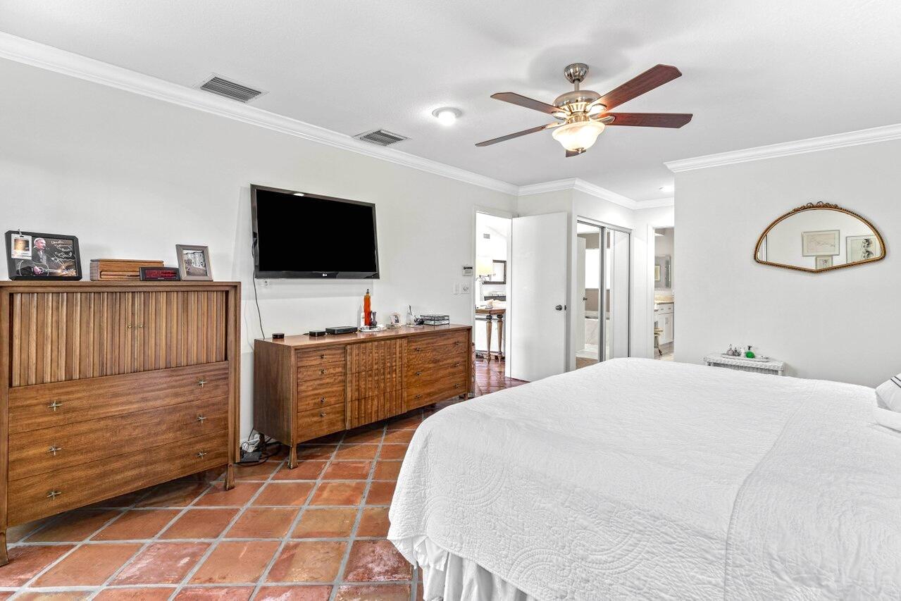 19 Glens Drive West Boynton Beach, FL 33436 - Photo 26 of 69 a bedroom with a bed and a flat screen tv