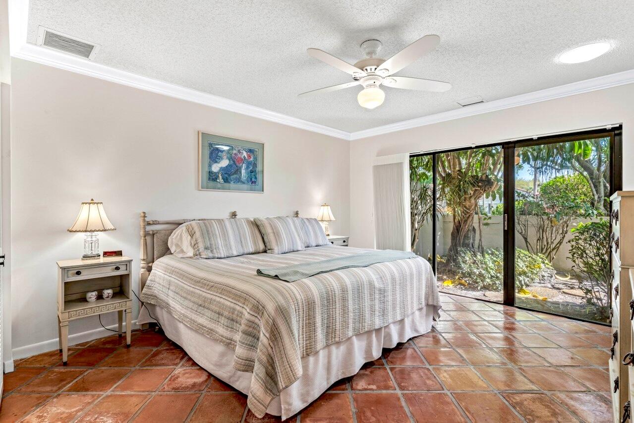 19 Glens Drive West Boynton Beach, FL 33436 - Photo 30 of 69 a bedroom with a large bed and a window