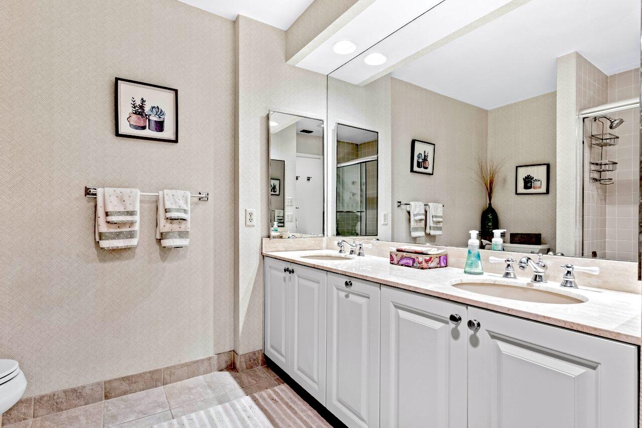 19 Glens Drive West Boynton Beach, FL 33436 - Photo 31 of 69 a bathroom with a sink and a mirror