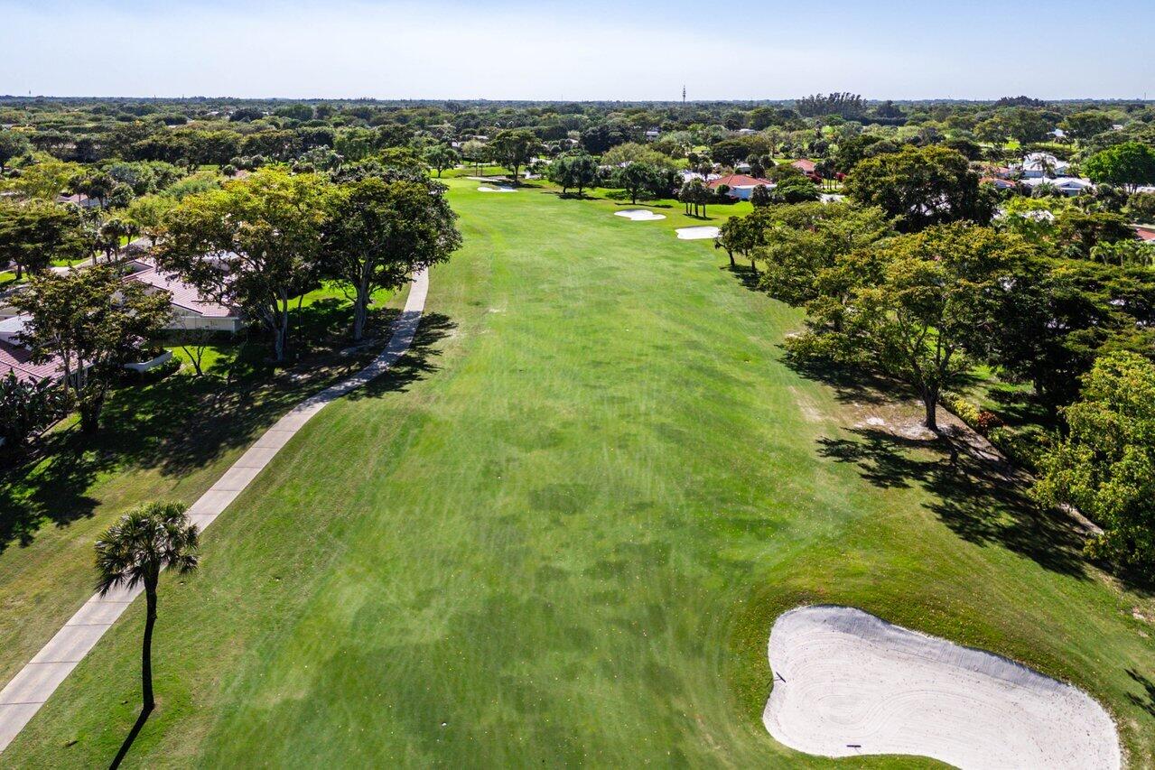 19 Glens Drive West Boynton Beach, FL 33436 - Photo 47 of 69 a view of a lake with a city