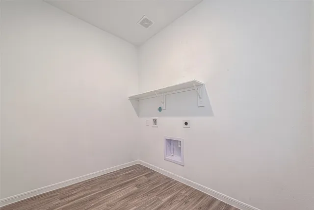 a view of room with wooden floor