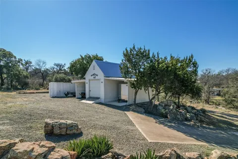 a house with trees in front of it