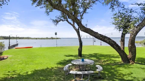 a view of a swimming pool with a yard