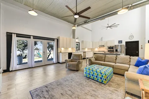 a living room with furniture or outdoor area with a large window