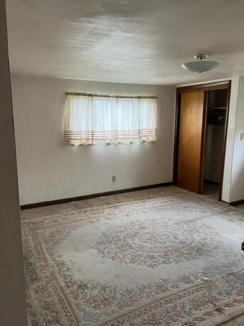 131 Stockton Avenue Uniontown, PA 15401 - Photo 11 of 14 a view of an empty room with closet and a window