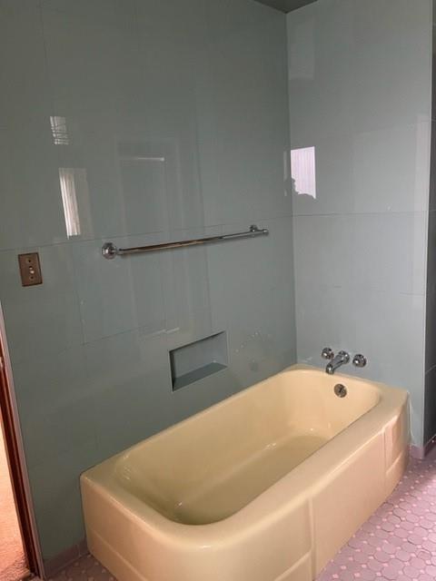 131 Stockton Avenue Uniontown, PA 15401 - Photo 14 of 14 a white bath tub sitting in a bathroom