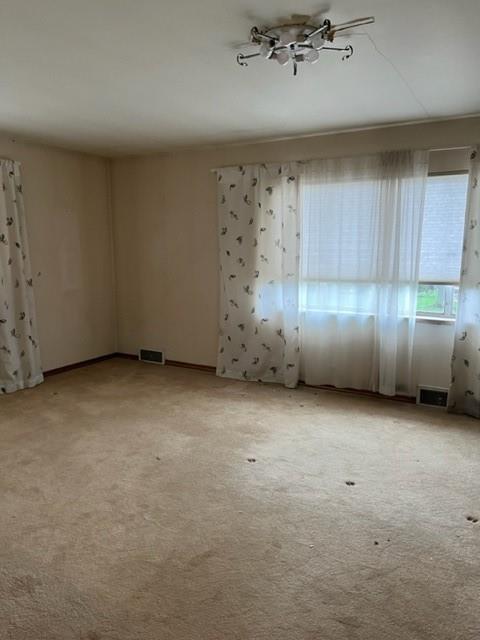 131 Stockton Avenue Uniontown, PA 15401 - Photo 4 of 14 an empty room with a fireplace