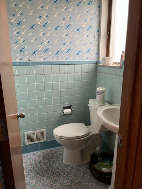131 Stockton Avenue Uniontown, PA 15401 - Photo 8 of 14 a bathroom with a toilet and a sink