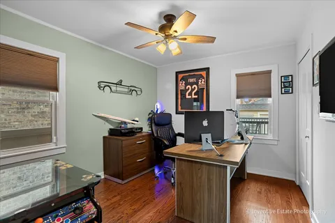 a work room with furniture and wooden floor