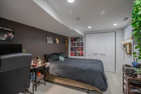 a bedroom with a bed and furniture