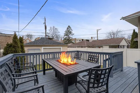 a view of a roof deck with wooden floor