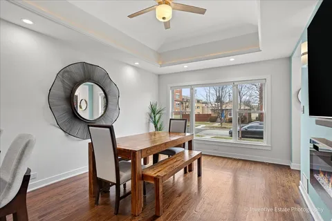 a view of a room with furniture wooden floor and window