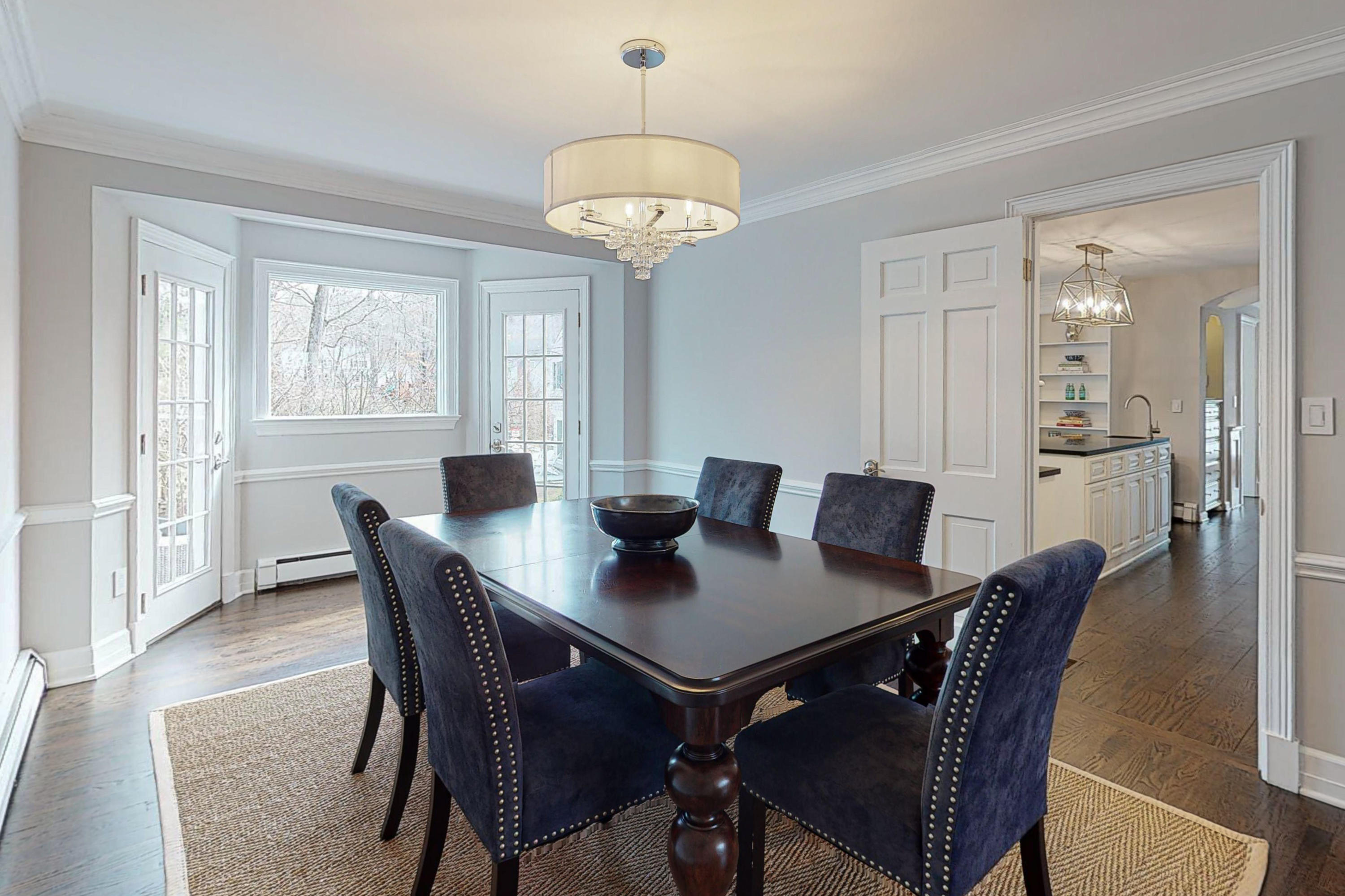 16 Barringer Road Darien, CT 06820 - Photo 11 of 43 a view of a dining room with furniture window and wooden floor