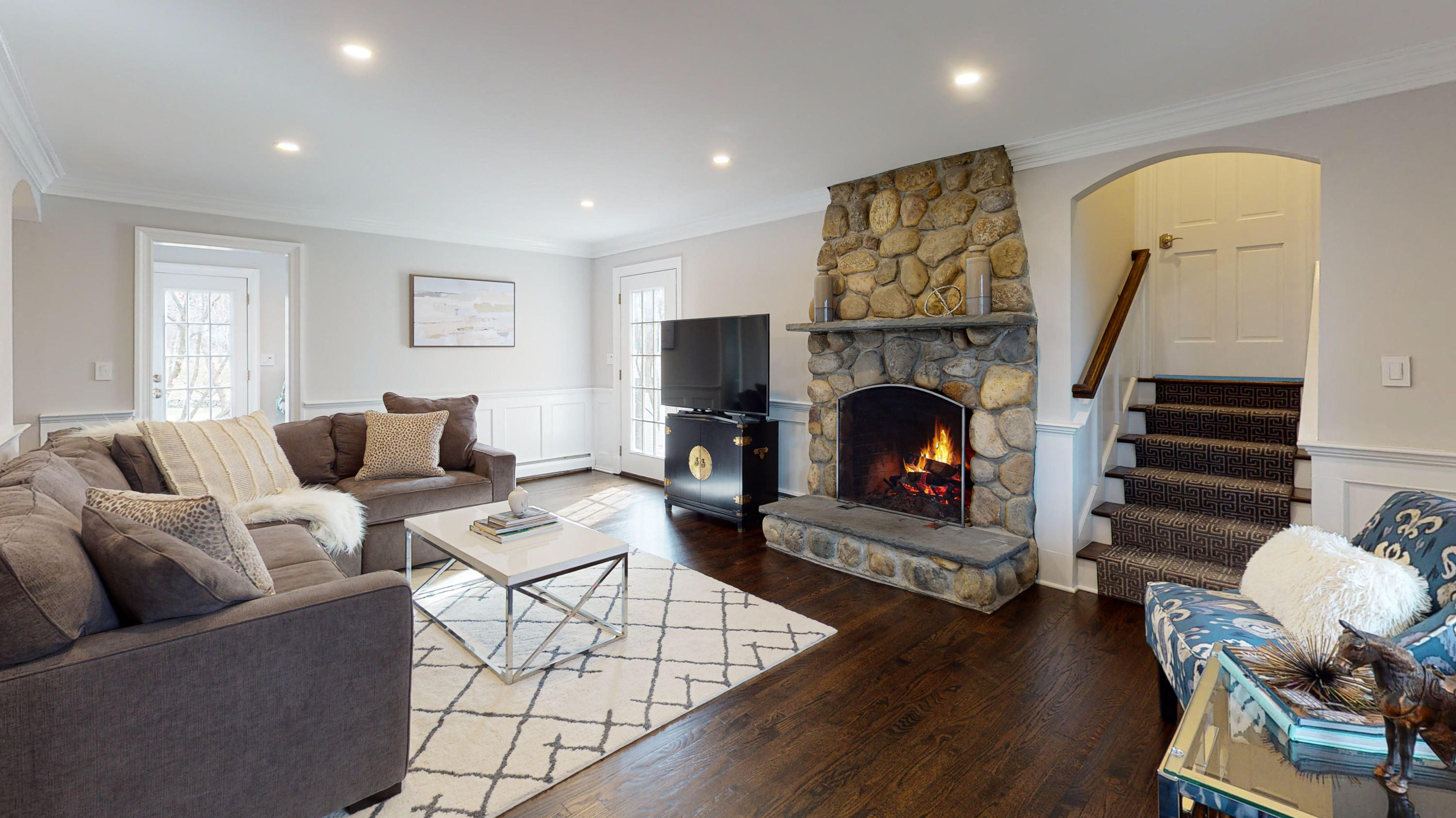 16 Barringer Road Darien, CT 06820 - Photo 12 of 43 a living room with furniture and a fireplace
