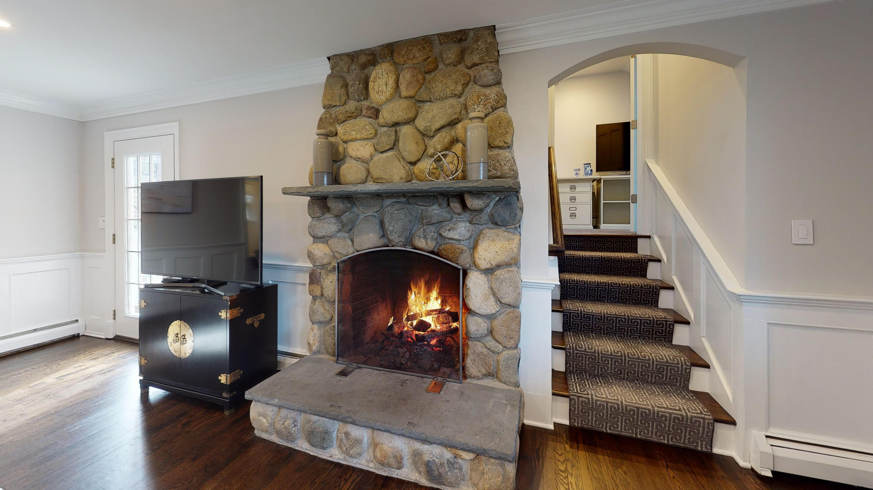 16 Barringer Road Darien, CT 06820 - Photo 13 of 43 a living room with furniture and a fireplace