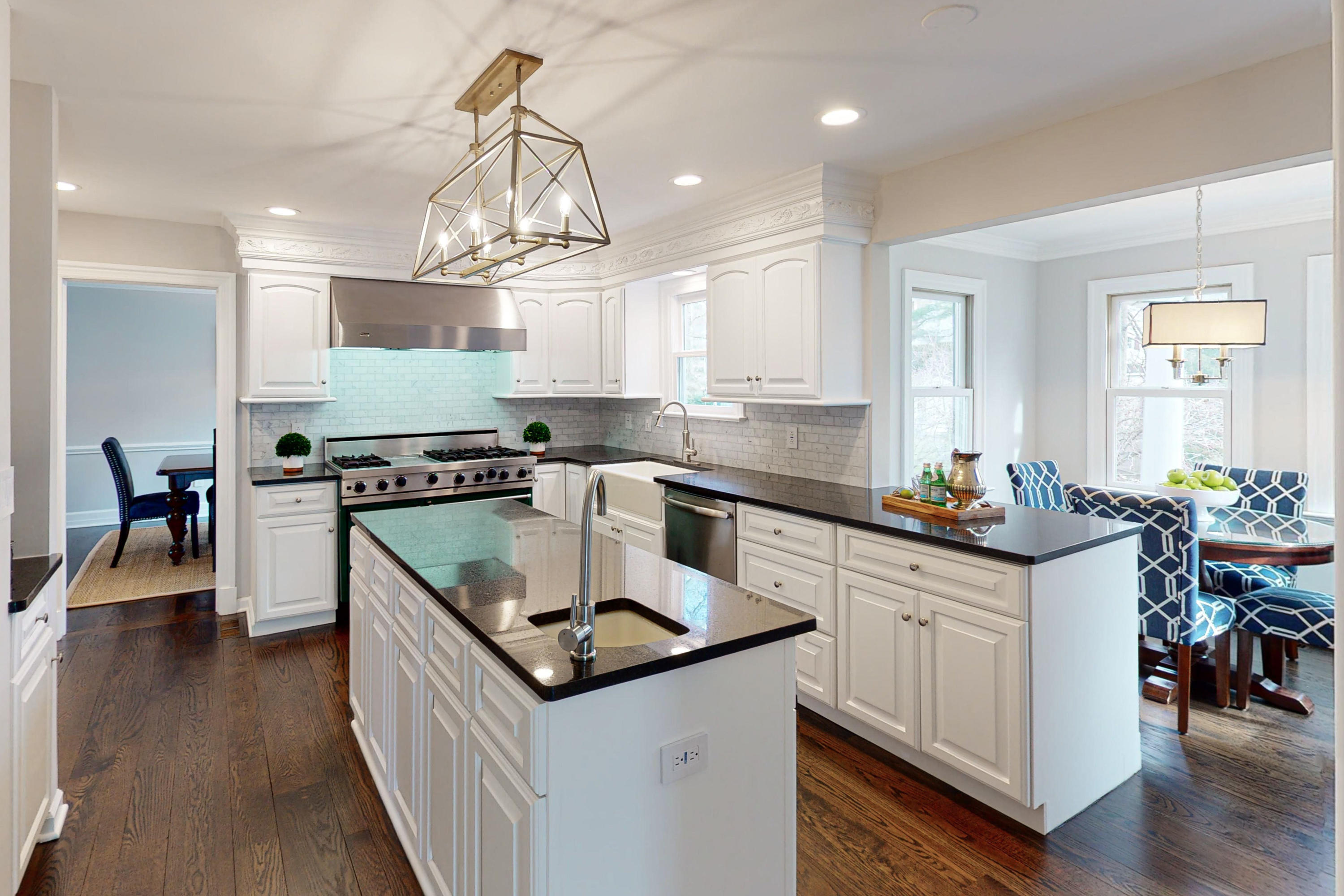 16 Barringer Road Darien, CT 06820 - Photo 17 of 43 a kitchen that has a lot of cabinets in it and wooden floors