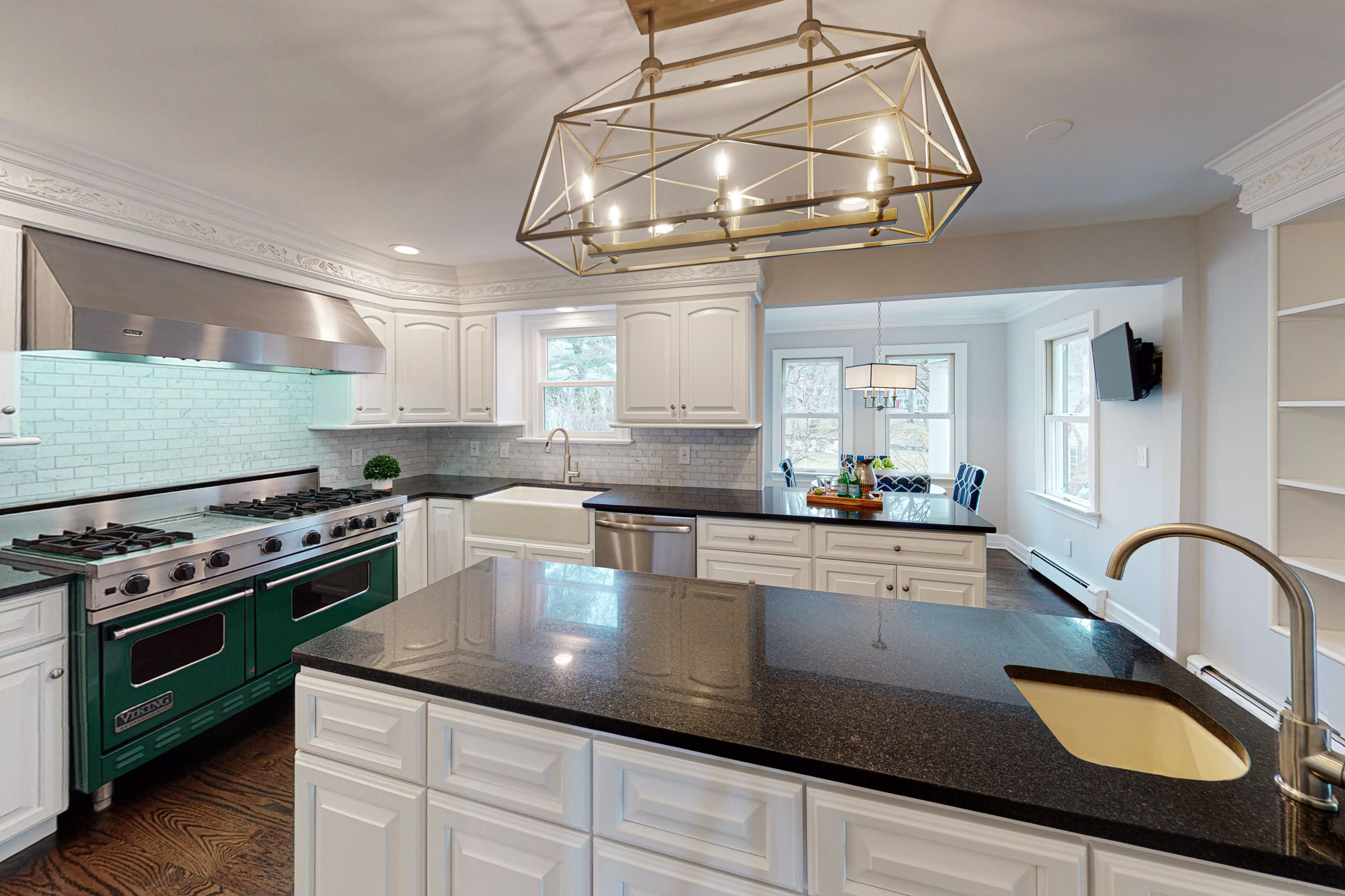 16 Barringer Road Darien, CT 06820 - Photo 18 of 43 a kitchen with stainless steel appliances granite countertop a sink a stove and cabinets