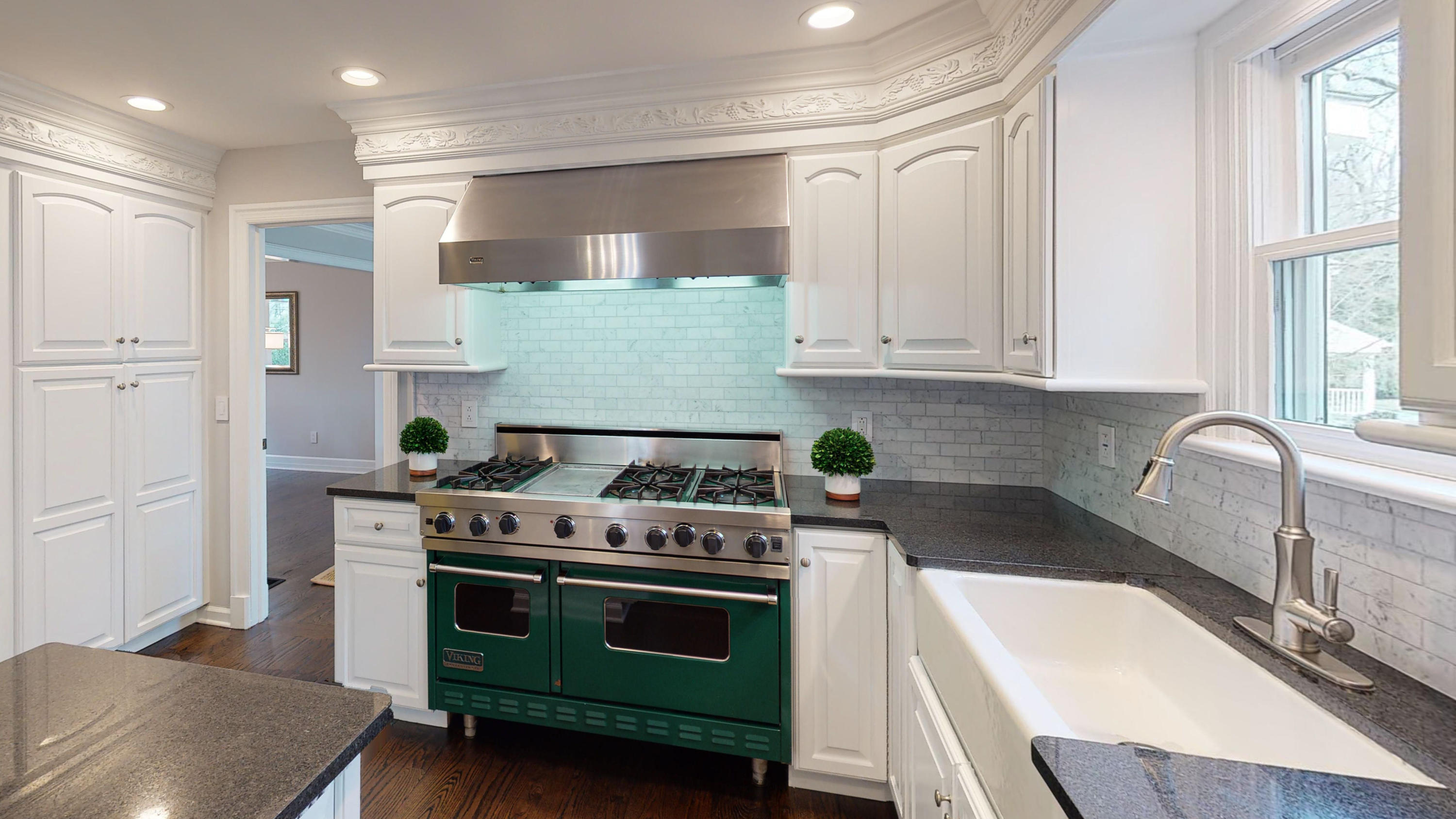 16 Barringer Road Darien, CT 06820 - Photo 20 of 43 a kitchen with granite countertop a sink a stove and cabinets